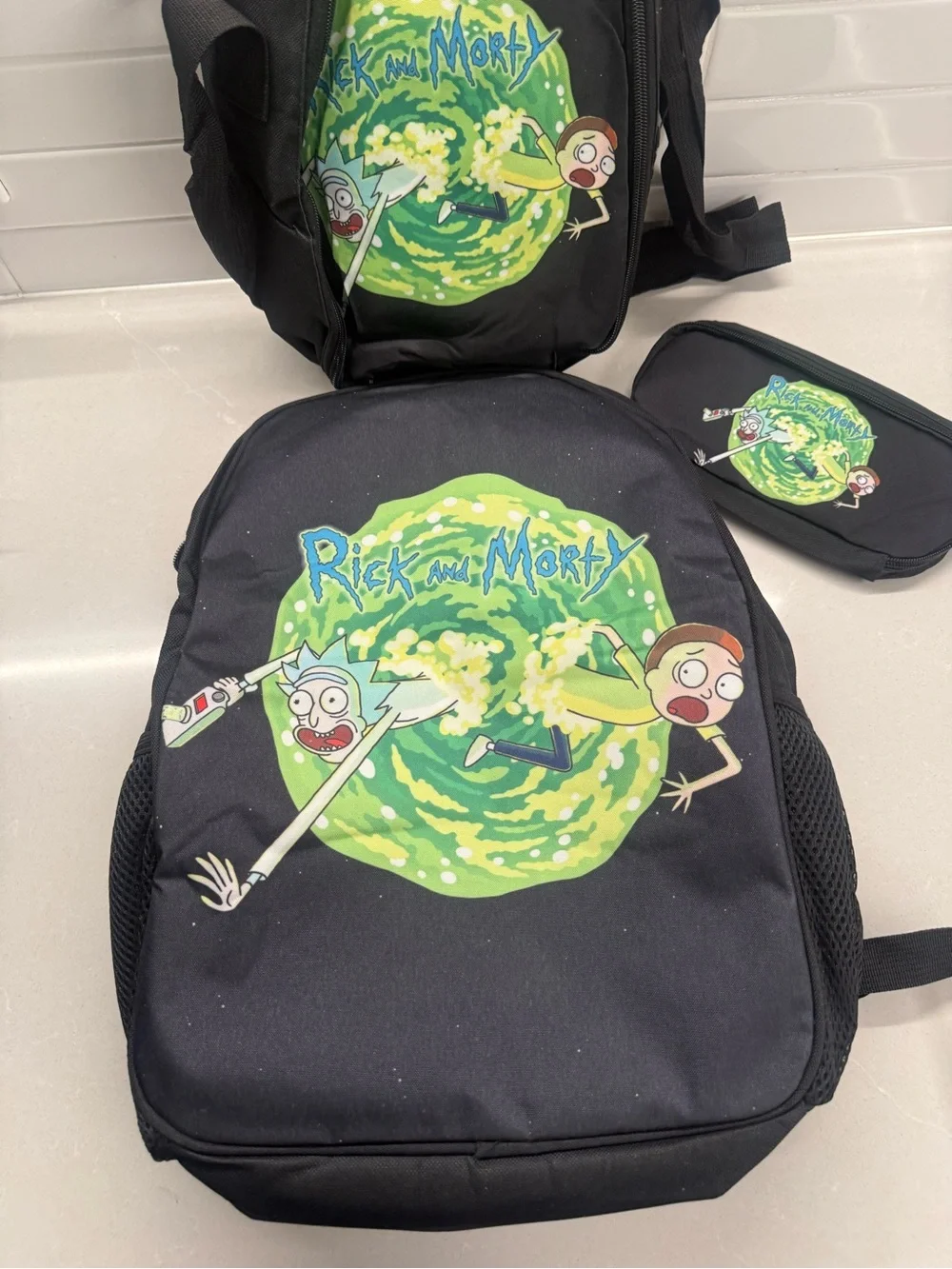 Rick and Morty 3 Piece School Set- Backpack Lunchbox, & Pencil Case.